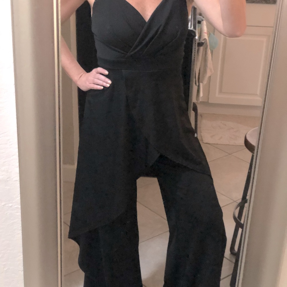 Fun black jumpsuit, legs cut up to thigh, but with material on outside, v flowy